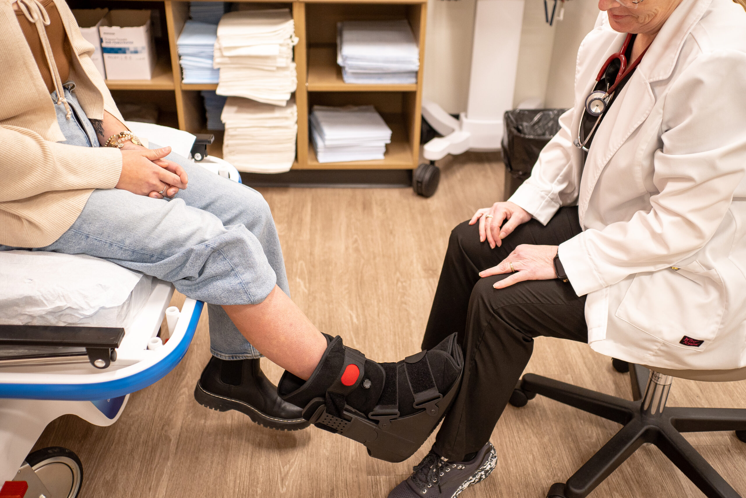 Person receiving care for a foot and ankle injury at an urgent care.